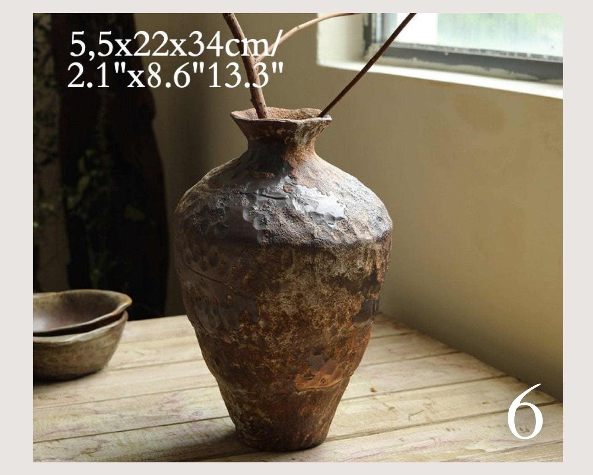 Wabi-Sabi Distressed Rustic Vase with textured, earthy tones on a wooden surface.